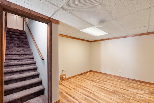 5563 Grace Chapel Rd, Hickory, NC 28601 - finished basement featuring a paneled ceiling, wood finished floors, and stairway