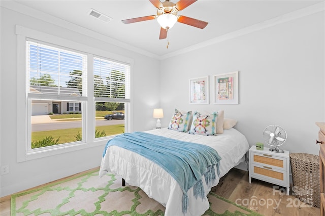 3610 Whitney Way Unit 2, Terrell, NC 28682 - bedroom with wood finished floors, crown molding, and ceiling fan