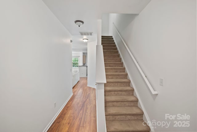 14664 Lions Paw St, Charlotte, NC 28273 - stairs featuring baseboards and wood finished floors