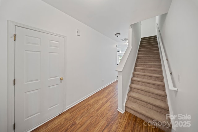 14664 Lions Paw St, Charlotte, NC 28273 - stairs with wood finished floors and baseboards
