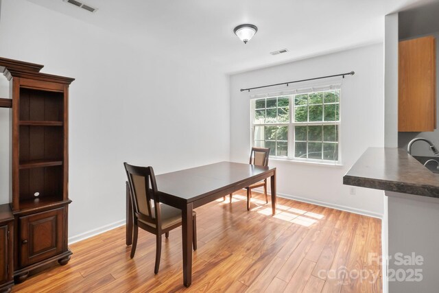 14664 Lions Paw St, Charlotte, NC 28273 - dining area featuring light wood-style floors and a desk