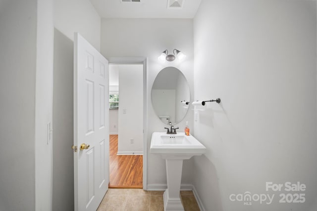 14664 Lions Paw St, Charlotte, NC 28273 - bathroom featuring tile patterned flooring and baseboards