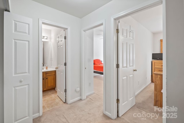 14664 Lions Paw St, Charlotte, NC 28273 - corridor featuring light carpet and light tile patterned floors