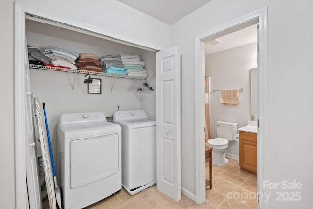 14664 Lions Paw St, Charlotte, NC 28273 - washroom with washer and clothes dryer and light tile patterned floors