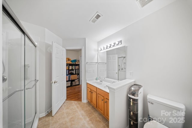 14664 Lions Paw St, Charlotte, NC 28273 - full bath with a stall shower, double vanity, tile patterned flooring, and a walk in closet