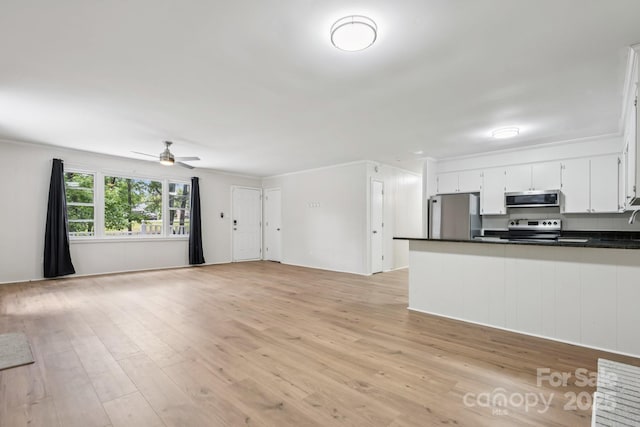 613 Davis St, Lancaster, SC 29720 - unfurnished living room with light wood-type flooring and a ceiling fan