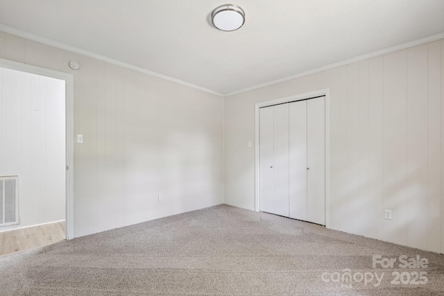 613 Davis St, Lancaster, SC 29720 - unfurnished bedroom with carpet, ornamental molding, and a closet