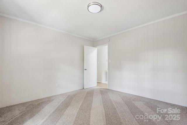 613 Davis St, Lancaster, SC 29720 - carpeted spare room featuring crown molding