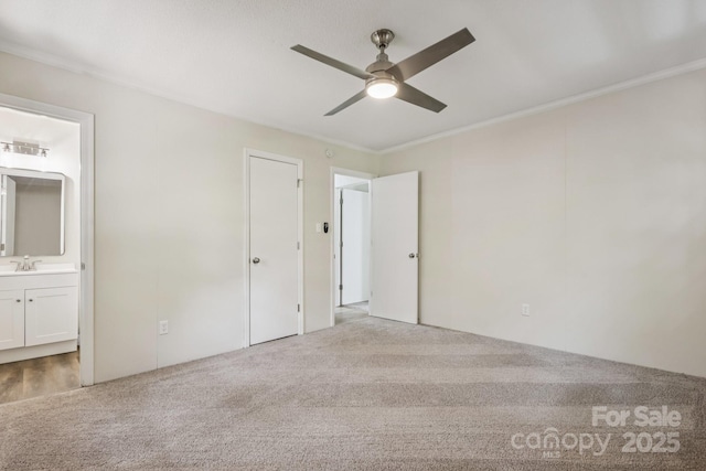 613 Davis St, Lancaster, SC 29720 - unfurnished bedroom featuring carpet floors, connected bathroom, ornamental molding, and ceiling fan