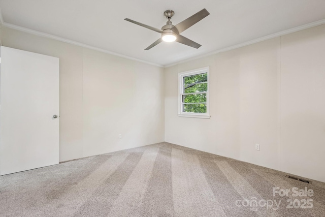 613 Davis St, Lancaster, SC 29720 - spare room featuring carpet, a ceiling fan, and crown molding