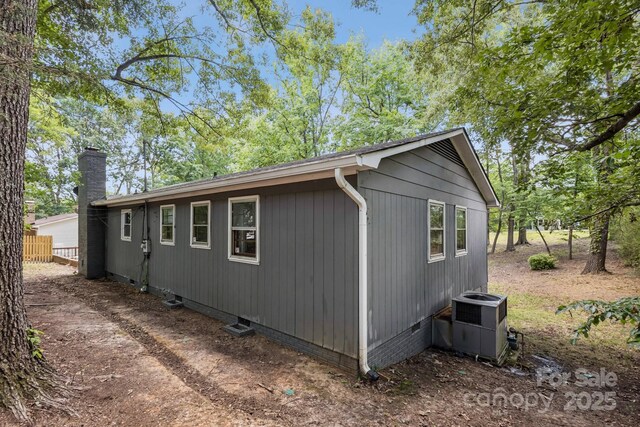 613 Davis St, Lancaster, SC 29720 - view of side of property featuring a central AC unit and a chimney