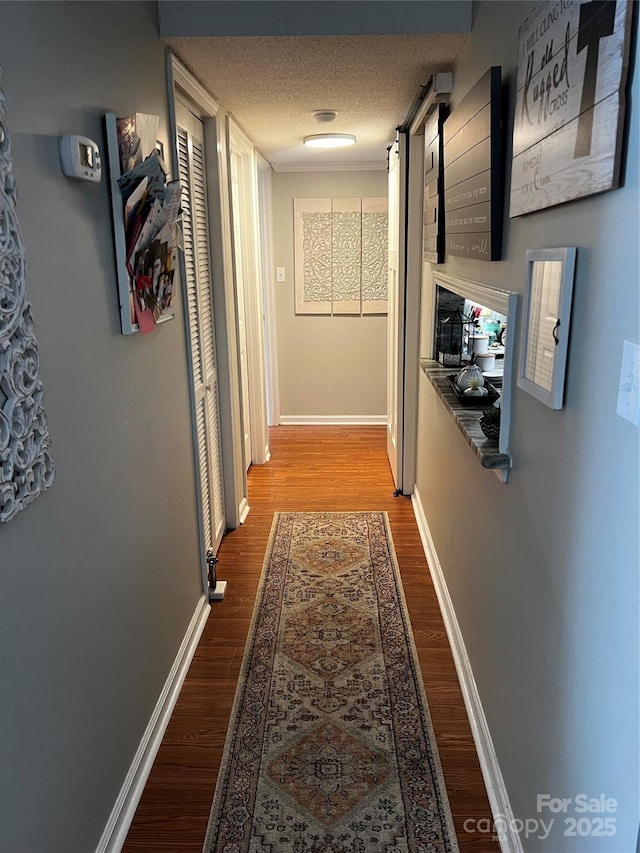140 Lake Concord Rd NE, Concord, NC 28025 - hallway with wood finished floors and a textured ceiling