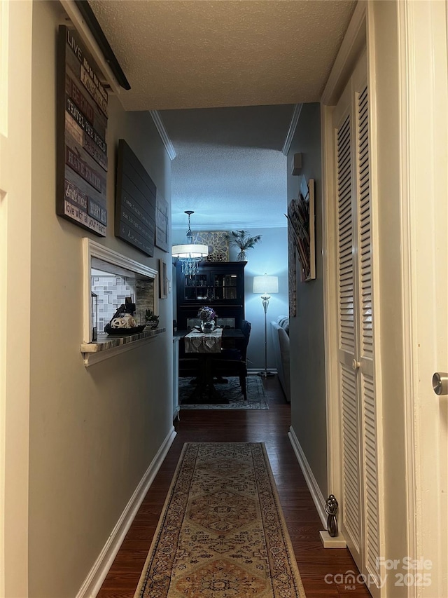 140 Lake Concord Rd NE, Concord, NC 28025 - hall with wood finished floors, a textured ceiling, and ornamental molding