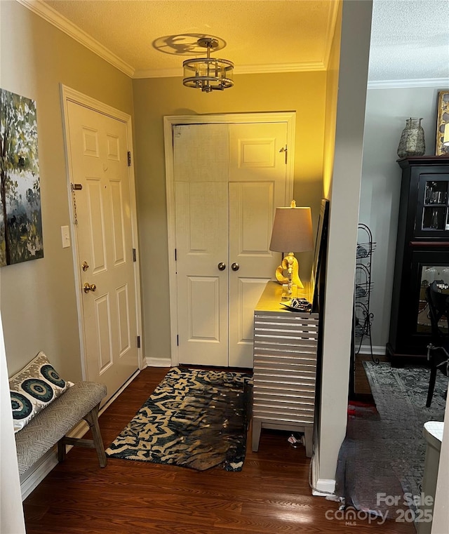 140 Lake Concord Rd NE, Concord, NC 28025 - entrance foyer featuring dark wood-style floors, crown molding, a chandelier, and a textured ceiling