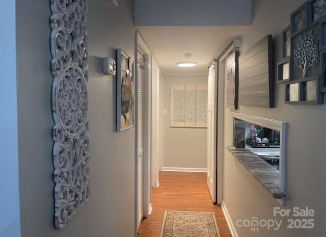 140 Lake Concord Rd NE, Concord, NC 28025 - hall with light wood-style floors and baseboards