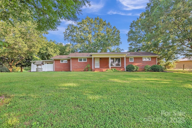37156 Southside Rd, Albemarle, NC 28001 - ranch-style house with a front yard and brick siding
