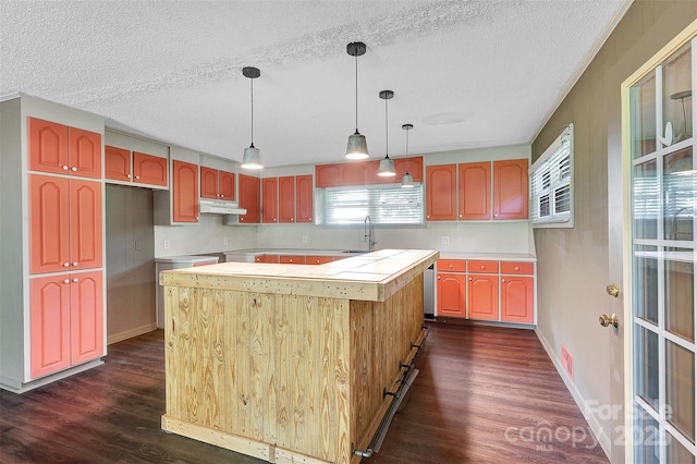 37156 Southside Rd, Albemarle, NC 28001 - kitchen with a center island, dark wood-type flooring, under cabinet range hood, light countertops, and a textured ceiling