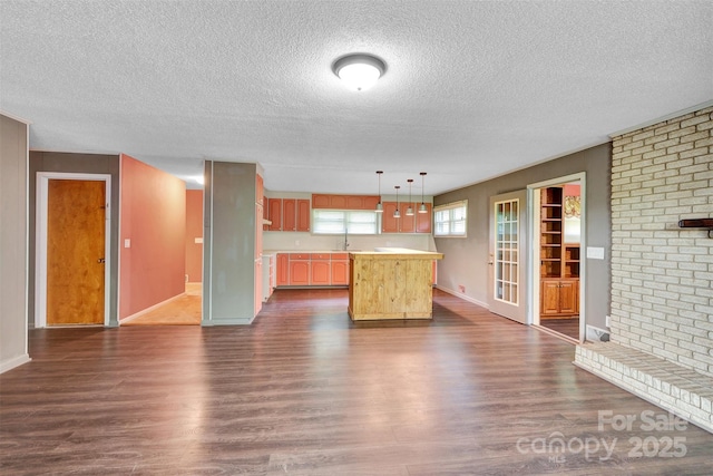 37156 Southside Rd, Albemarle, NC 28001 - kitchen with a textured ceiling, dark wood-style floors, light countertops, a center island, and decorative light fixtures