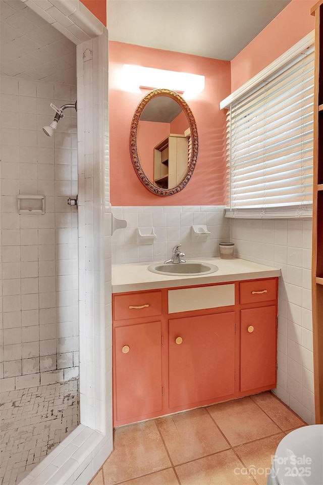37156 Southside Rd, Albemarle, NC 28001 - bathroom with tile walls, vanity, tiled shower, tile patterned floors, and a wainscoted wall