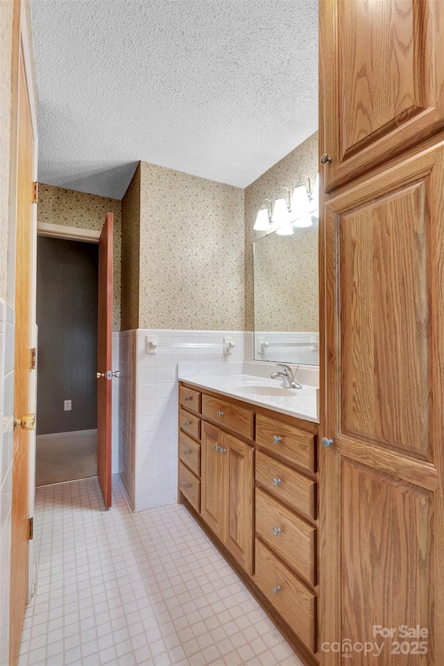 37156 Southside Rd, Albemarle, NC 28001 - bathroom featuring wallpapered walls, wainscoting, vanity, a textured ceiling, and tile patterned flooring