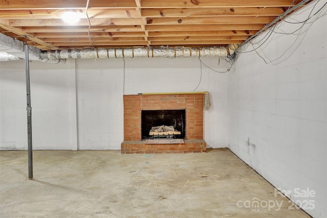 37156 Southside Rd, Albemarle, NC 28001 - unfinished basement with a brick fireplace and concrete block wall