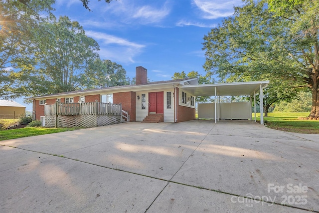 37156 Southside Rd, Albemarle, NC 28001 - ranch-style home featuring a chimney, brick siding, concrete driveway, and a carport