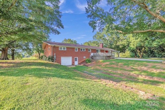 37156 Southside Rd, Albemarle, NC 28001 - view of property exterior featuring brick siding, a garage, a chimney, a lawn, and driveway