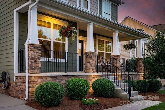 3701 Methodist Church Ln, Waxhaw, NC 28173 - view of exterior entry with stone siding and covered porch