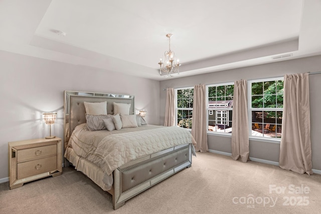 3701 Methodist Church Ln, Waxhaw, NC 28173 - bedroom with a raised ceiling, light carpet, and a chandelier