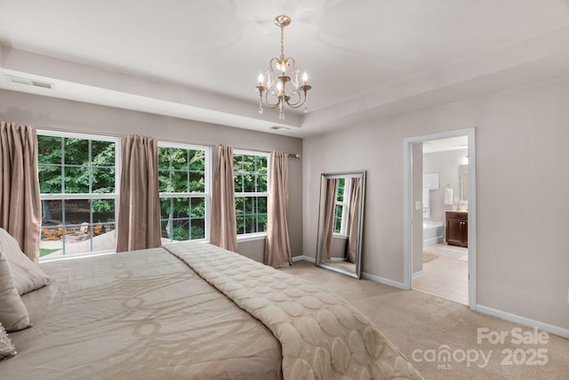 3701 Methodist Church Ln, Waxhaw, NC 28173 - bedroom with light colored carpet, a chandelier, and ensuite bath