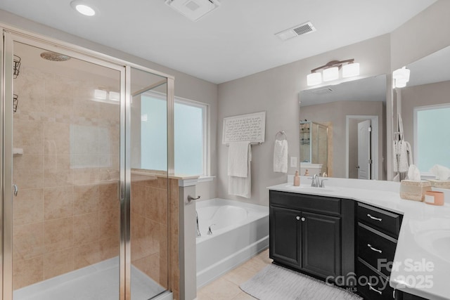 3701 Methodist Church Ln, Waxhaw, NC 28173 - bathroom featuring vanity, a garden tub, a shower stall, and tile patterned flooring