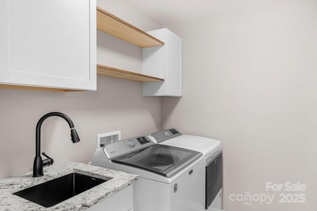 3701 Methodist Church Ln, Waxhaw, NC 28173 - laundry area featuring washing machine and dryer and cabinet space
