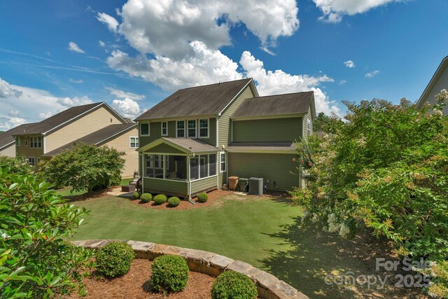 3701 Methodist Church Ln, Waxhaw, NC 28173 - rear view of house featuring a sunroom, roof with shingles, and a lawn