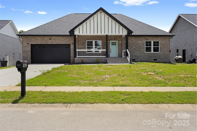 103 Wadesborough Pl, Wadesboro, NC 28170 - view of front of house featuring a garage, brick siding, driveway, and board and batten siding