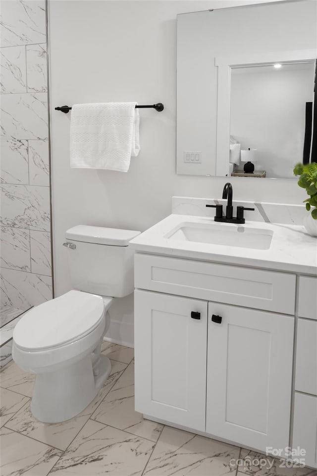103 Wadesborough Pl, Wadesboro, NC 28170 - bathroom featuring marble look tiles, vanity, and a shower