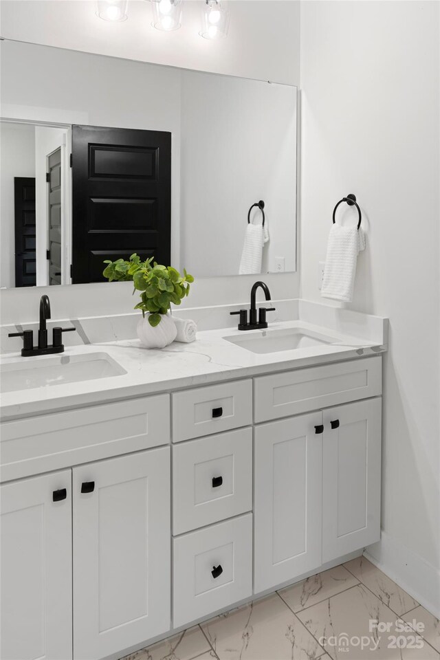 103 Wadesborough Pl, Wadesboro, NC 28170 - bathroom featuring marble look tiles and double vanity