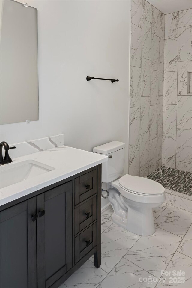 103 Wadesborough Pl, Wadesboro, NC 28170 - bathroom with marble look tiles, vanity, and tiled shower