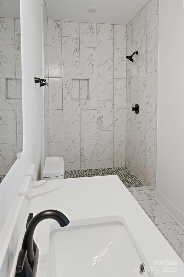 103 Wadesborough Pl, Wadesboro, NC 28170 - bathroom with a tile shower and marble finish flooring