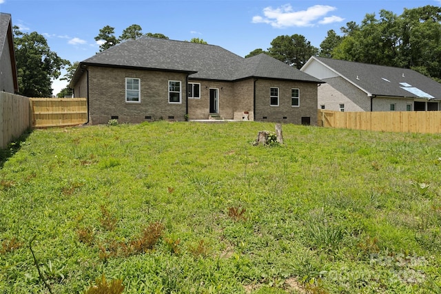 103 Wadesborough Pl, Wadesboro, NC 28170 - back of house featuring crawl space, a fenced backyard, a shingled roof, and brick siding