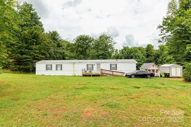 401 Webb Church Rd, Ellenboro, NC 28040 - view of front of house with a shed, a front lawn, and a wooden deck