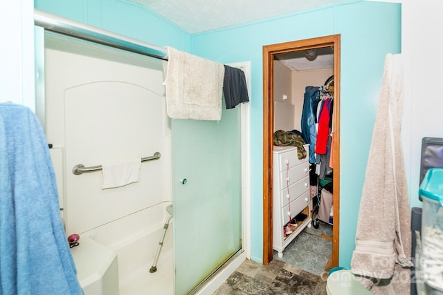 401 Webb Church Rd, Ellenboro, NC 28040 - full bath featuring an enclosed shower, a walk in closet, and stone finish floors