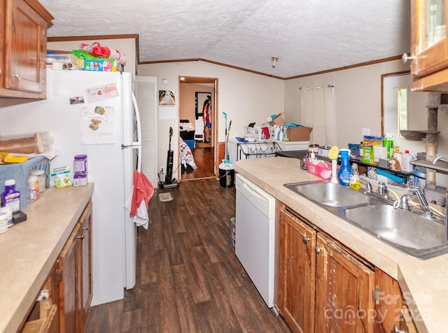401 Webb Church Rd, Ellenboro, NC 28040 - kitchen with white appliances, ornamental molding, brown cabinetry, light countertops, and a textured ceiling