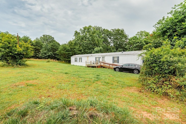 401 Webb Church Rd, Ellenboro, NC 28040 - view of green lawn featuring a wooden deck