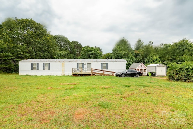 401 Webb Church Rd, Ellenboro, NC 28040 - rear view of property featuring a storage unit and a lawn