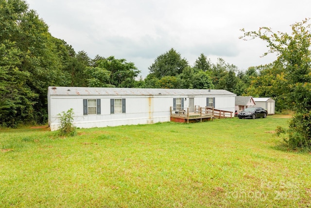 401 Webb Church Rd, Ellenboro, NC 28040 - back of house featuring a deck, a lawn, and a storage shed