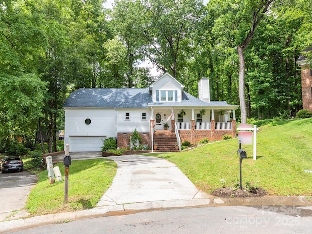 6934 Loretta Pl, Charlotte, NC 28215 - view of front of house with a chimney, asphalt driveway, a porch, a garage, and a front yard