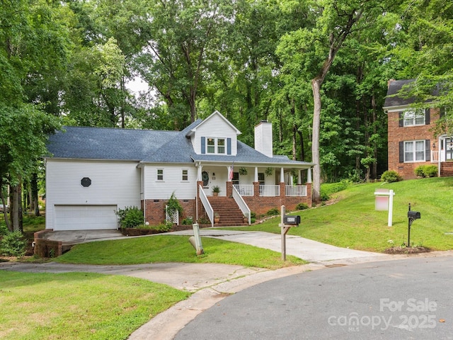 6934 Loretta Pl, Charlotte, NC 28215 - view of front of home with a porch, a chimney, a front lawn, stairs, and an attached garage