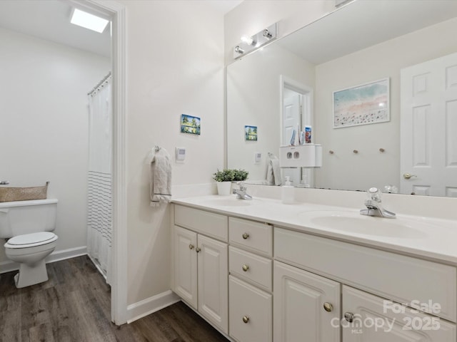 6934 Loretta Pl, Charlotte, NC 28215 - full bath featuring double vanity and wood finished floors
