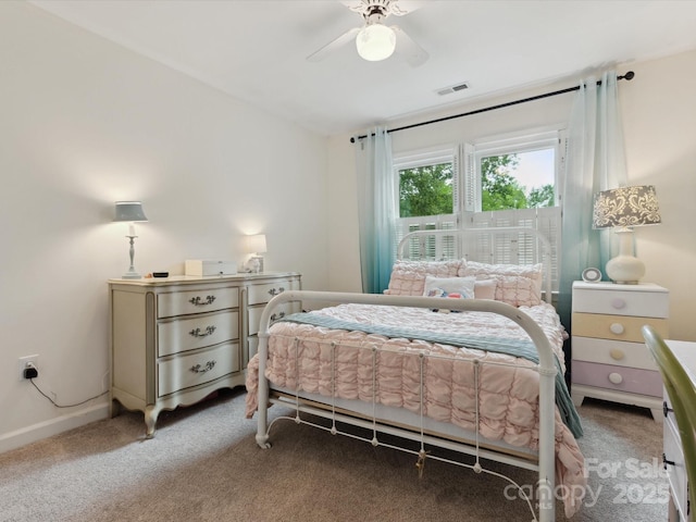 6934 Loretta Pl, Charlotte, NC 28215 - carpeted bedroom with ceiling fan and baseboards