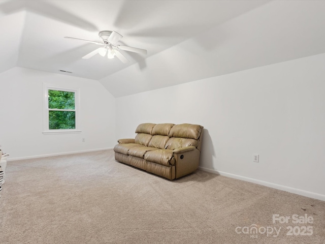 6934 Loretta Pl, Charlotte, NC 28215 - living area with carpet flooring, vaulted ceiling, and ceiling fan